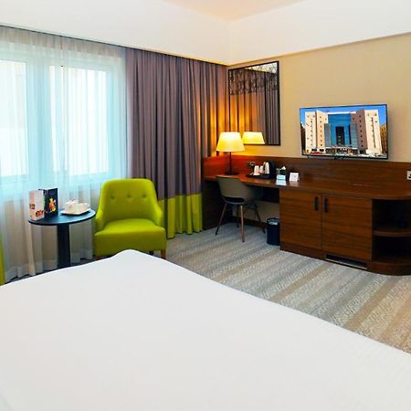 The Grand Lux Hotel Doha Buitenkant foto A room at the hotel