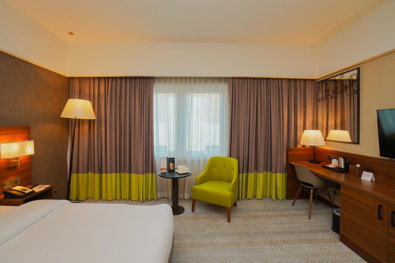 The Grand Lux Hotel Doha Buitenkant foto A room at the hotel