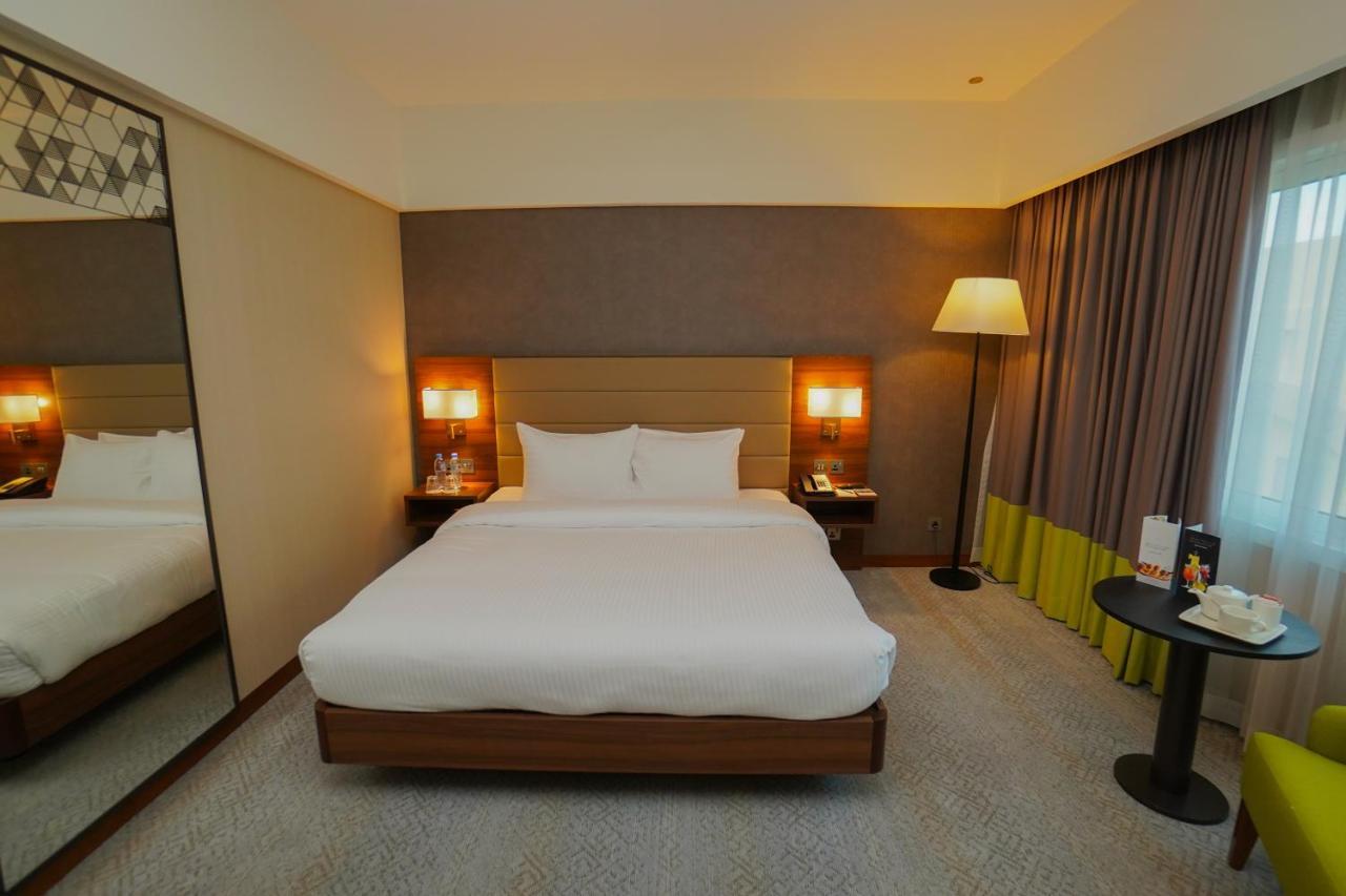 The Grand Lux Hotel Doha Buitenkant foto A room at the hotel