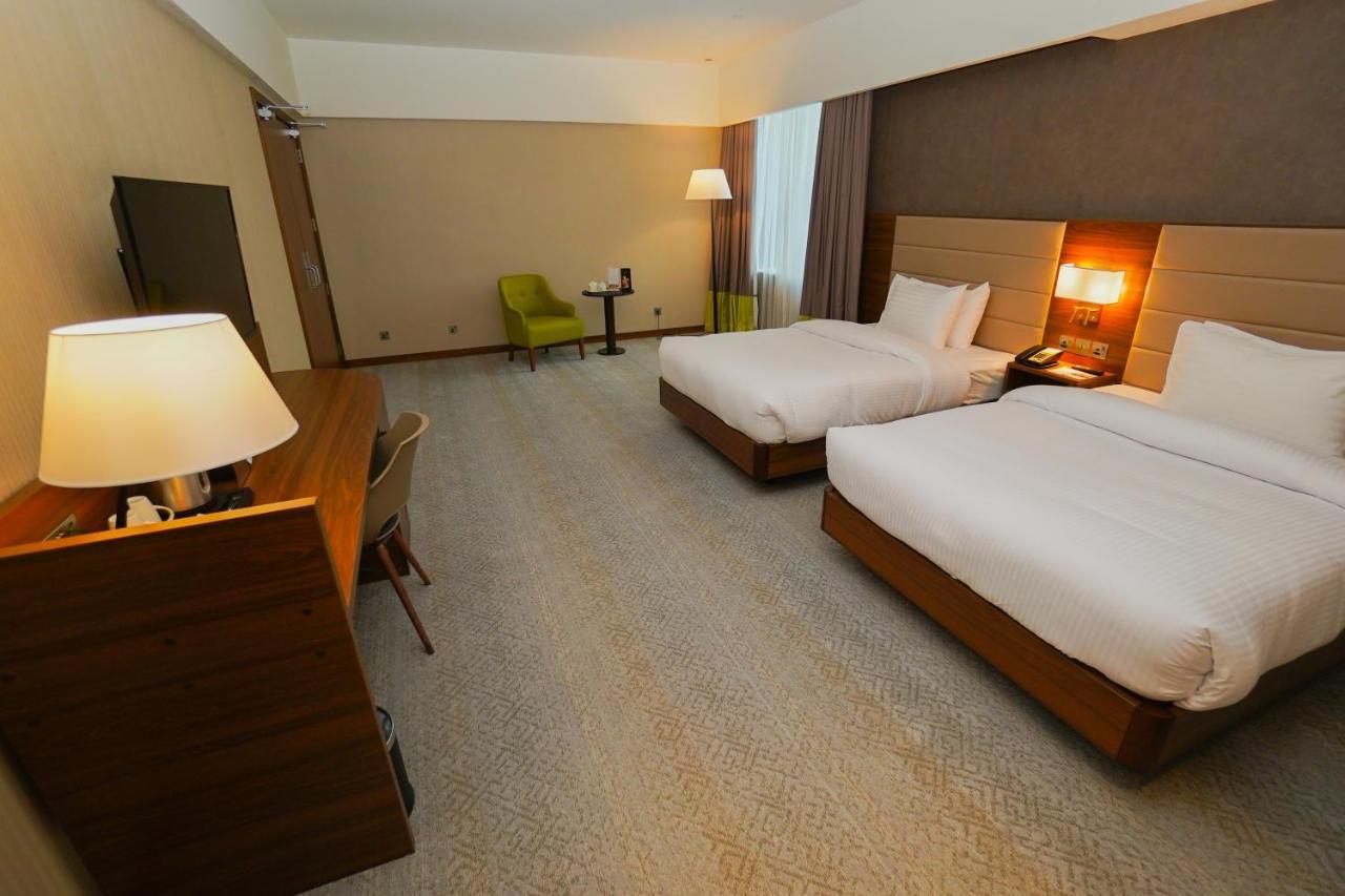 The Grand Lux Hotel Doha Buitenkant foto A room at the hotel