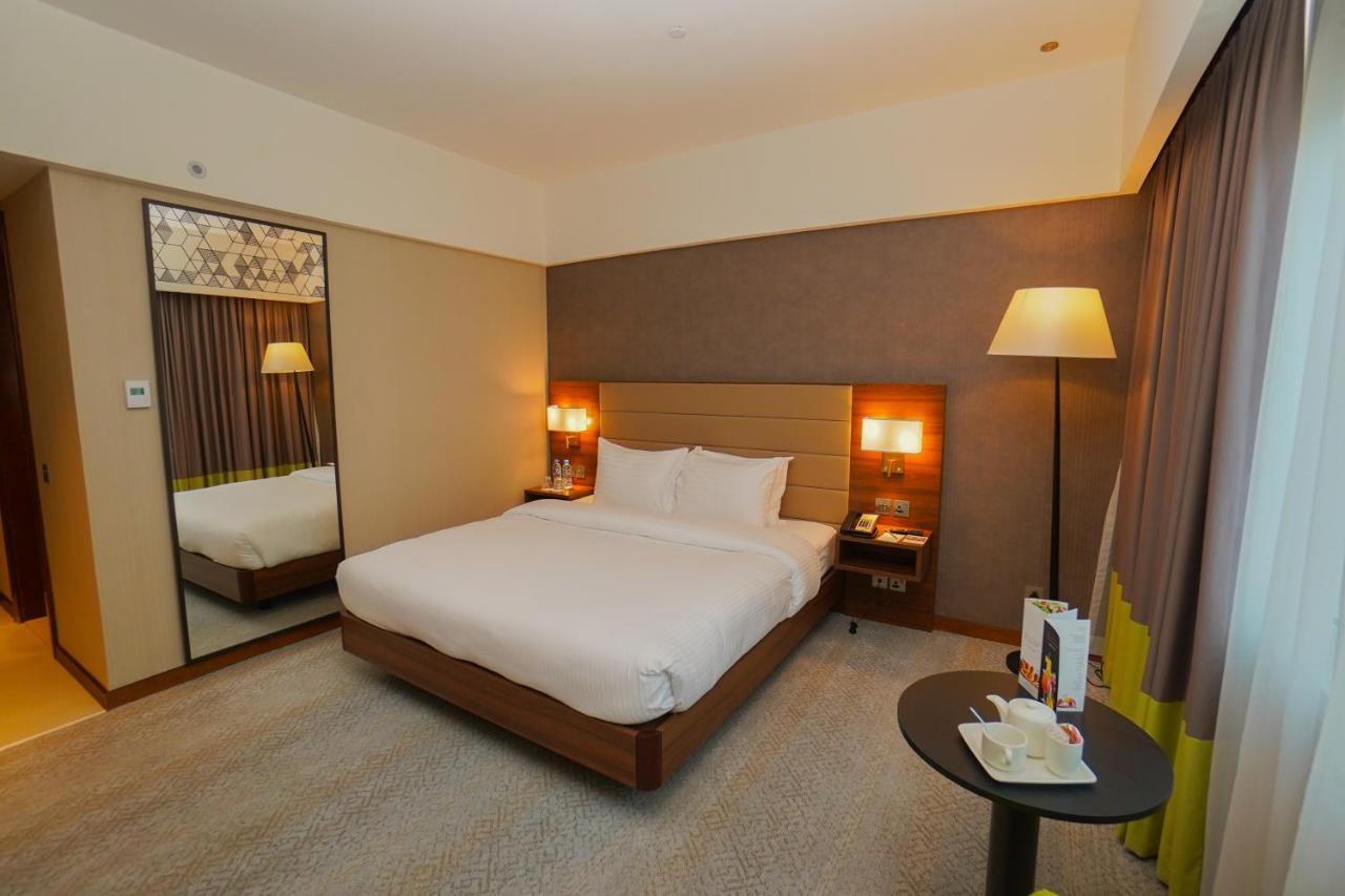 The Grand Lux Hotel Doha Buitenkant foto A room at the hotel