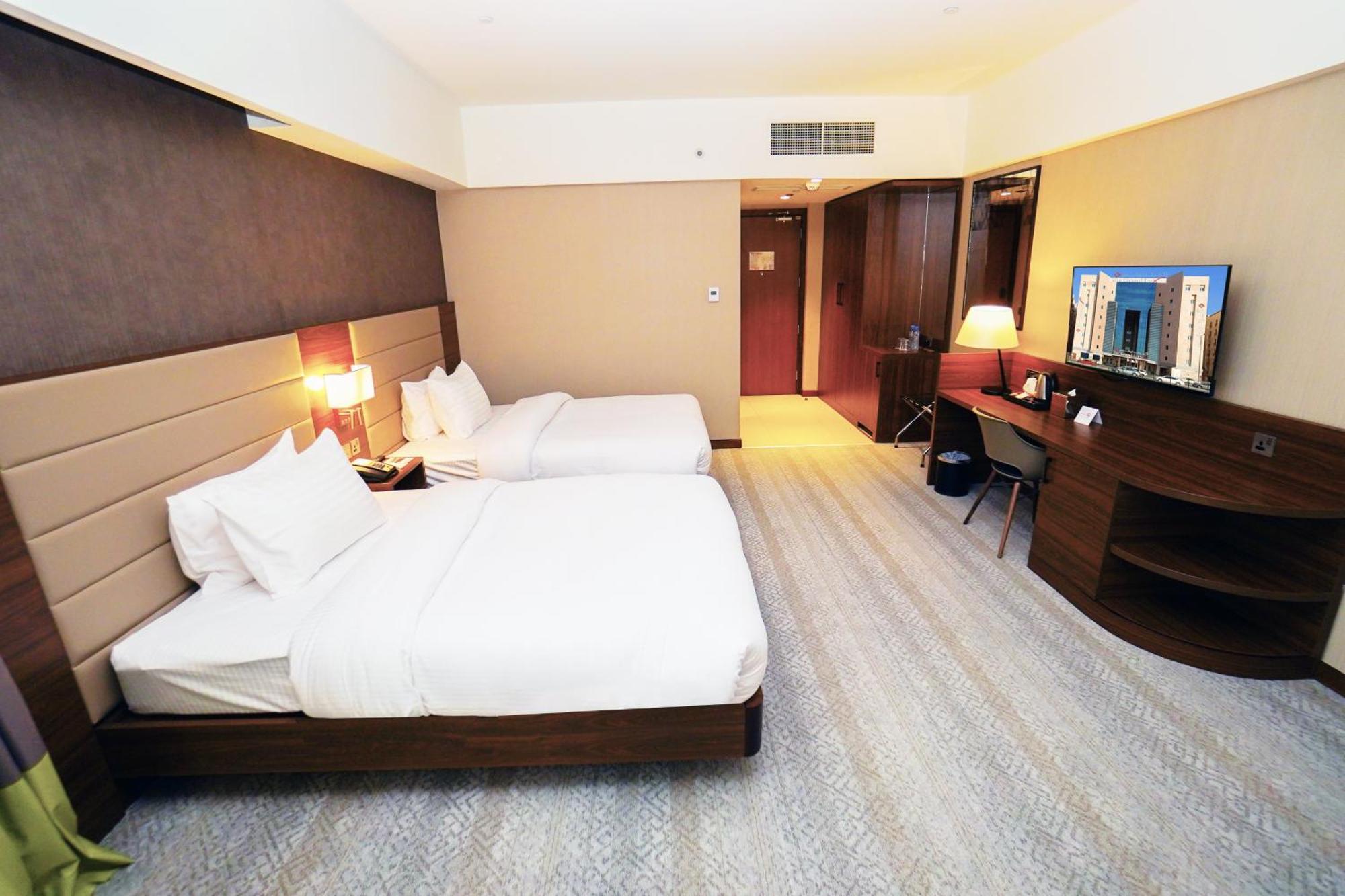 The Grand Lux Hotel Doha Buitenkant foto Deluxe Room
